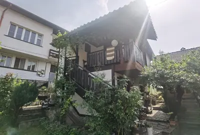an apartment building with a courtyard with trees at Room for guests in Smolyan
