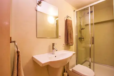 a bathroom with a sink and a shower and a toilet at Garmen Hills Guest Houses in Garmen
