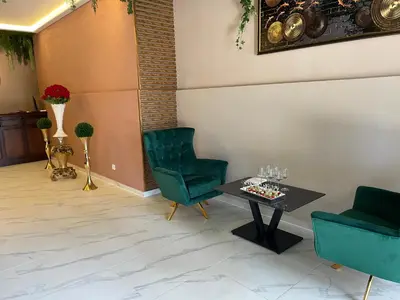 a room with a table and two chairs and a table at Complex Nero in Pamporovo