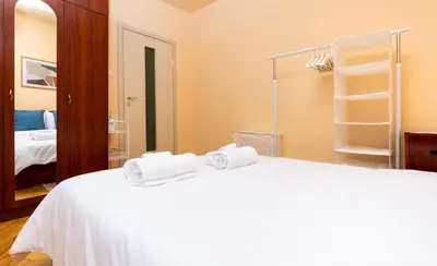 a bedroom with a white bed and a mirror at The Cozy Home 1-Bedroom in Central Plovdiv by Flat Mаnager in Plovdiv