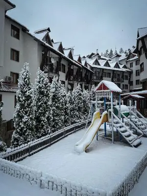 a playground covered in snow in a resort at Castle Romance - Pamporovo in Pamporovo