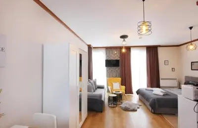 a living room with a bed and a couch at Luxury Suite Ivana in Bansko