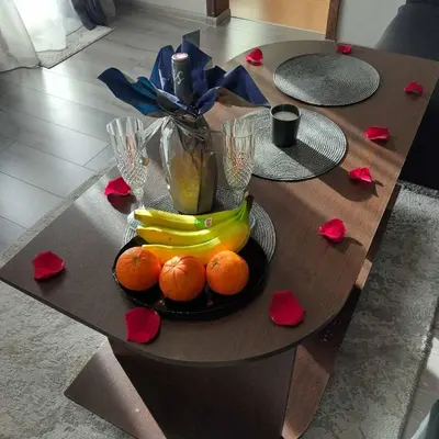 a table with a plate of oranges and bananas at Angel&MAR in Velingrad