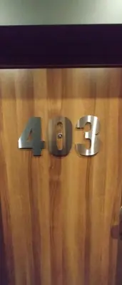 a wooden wall with the number on it at Apartment House - Delta in Sofia