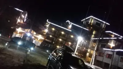 a city street at night with street lights at Alexander 3327 in Bansko