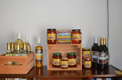 a group of bottles of honey sitting on a table at Villa Bella - A Rila Monastery Adventure in Kocherinovo