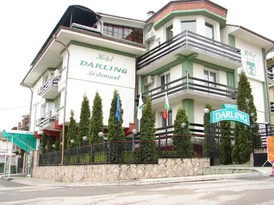 a building with a sign on the side of it at Darling Hotel in Sofia