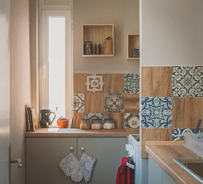 a kitchen with a counter with tiles on the wall at Temple House in Plovdiv