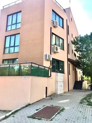 an apartment building with a balcony and a sidewalk at Nordic Style Apartment with Parking place in Sofia