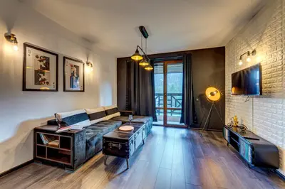a living room with a couch and a table at Black Box Studio in Smolyan