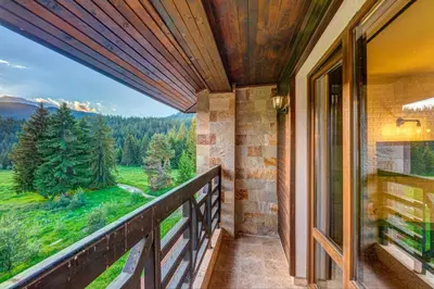 a balcony with a view of the mountains at Black Box Studio in Smolyan