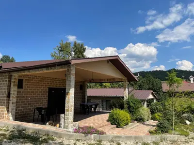 a brick house with a patio with a roof at Комплекс Омайник in Kalofer