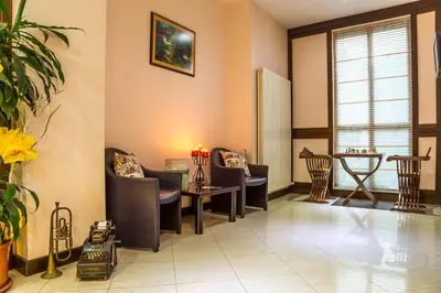 a waiting room with chairs and a table at Family Hotel Teteven in Teteven