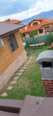a backyard of a house with a brick oven at Вила ВлаиДа in Sapareva Banya