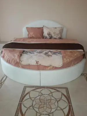 a bed in a room with a bedvisor at Sandanski Peak Guest Rooms in Sandanski
