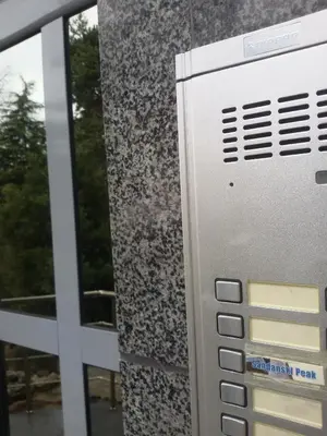 a close up of a metal door with a window at Sandanski Peak Guest Rooms in Sandanski