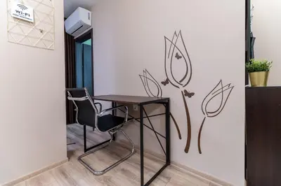 a table and two chairs in a room at City Central 1-Bed Apartments in Plovdiv