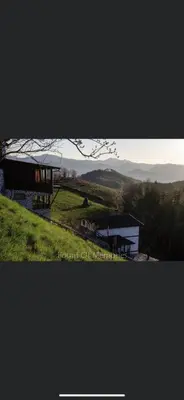 a building sitting on top of a lush green hill at Александрова вила 2 in Zlatograd