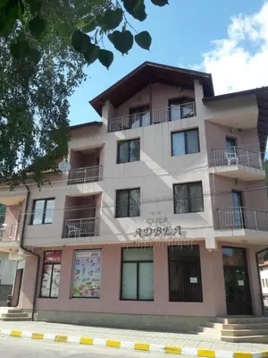 an apartment building on the side of the street at Advel Guest House in Madzhare
