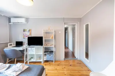 a living room with a desk and a computer at Lovely 1-bedroom apartment in the center of Sofia in Sofia