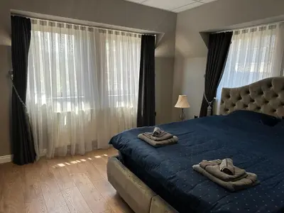 a bedroom with a bed with two towels on it at Apartaments Filipopolis in Plovdiv