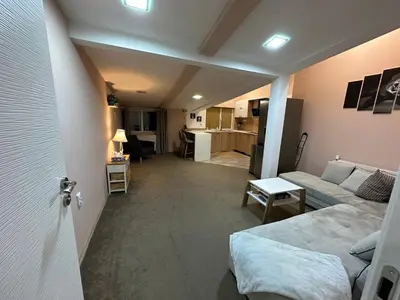 a living room with a couch and a table at Apartaments Filipopolis in Plovdiv