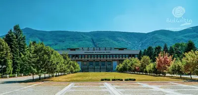 a building with a large lawn in front of it at Aurora Oasis - AC & Lift in Vibrant Downtown Sofia by Flat Mаnager in Sofia