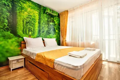 a bedroom with a bed with a green wall at Aurora Oasis - AC & Lift in Vibrant Downtown Sofia by Flat Mаnager in Sofia