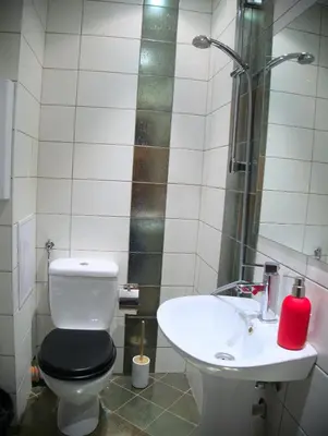 a bathroom with a toilet and a sink at ParkView Complex Large Flat Next to Ski Lift in Bansko