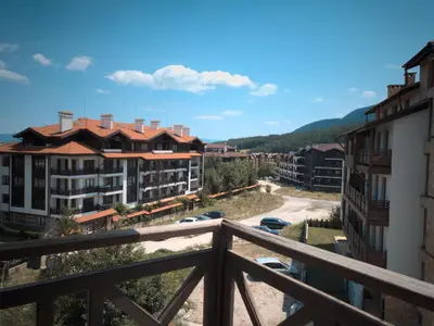 a view of a city from a balcony at ParkView Complex Large Flat Next to Ski Lift in Bansko