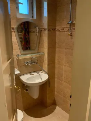 a bathroom with a white sink and a mirror at 113 in Sofia with 2BR and 2 full bath in Sofia