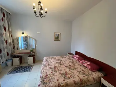a bedroom with a bed and a mirror and a chandelier at 113 in Sofia with 2BR and 2 full bath in Sofia