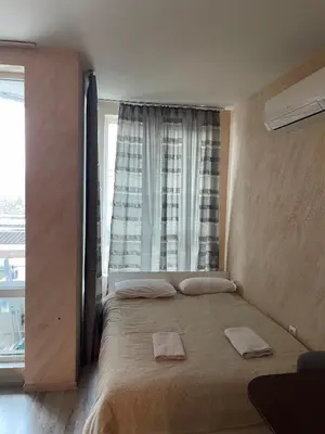 a bedroom with a bed with two towels on it at Colonel apartment 945 in Sofia