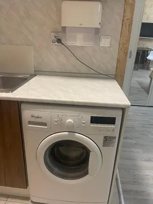 a washing machine in a kitchen with a counter at Colonel apartment 958 in Sofia