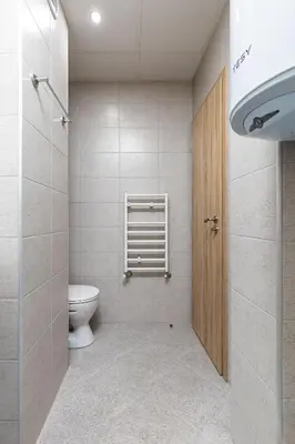 a small bathroom with a toilet and a door at Stylish 2BD Apartment with a Nice Cozy Terrace by Flat Mаnager in Plovdiv