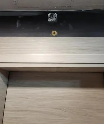 a wooden drawer with a clock on top of it at Colonel apartment Luxury in Sofia
