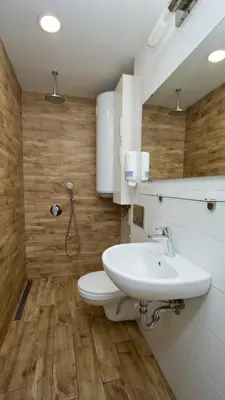 a bathroom with a white toilet and a sink at Colonel apartment dream in Sofia