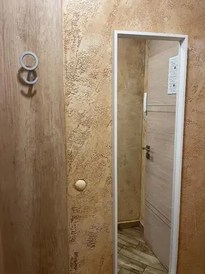 a door leading to a bathroom with a shower at Colonel apartment Royal in Sofia
