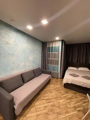 a living room with two beds and a couch at Colonel apartment Select in Sofia