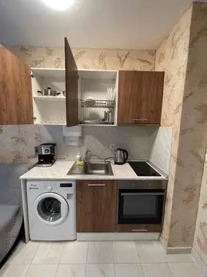 a kitchen with a sink and a washing machine at Colonel apartment 937 in Sofia