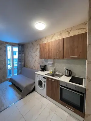 a kitchen with a sink and a washing machine at Colonel apartment 937 in Sofia