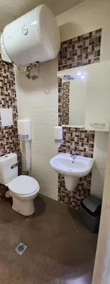 a bathroom with a toilet and a sink at Colonel apartment 941 in Sofia
