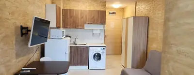 a kitchen with a washing machine and a washer at Colonel apartment 941 in Sofia