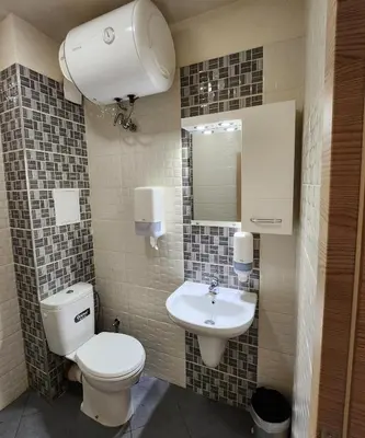a bathroom with a toilet and a sink at Colonel apartment 953 in Sofia