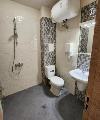 a bathroom with a toilet and a sink at Colonel apartment 953 in Sofia