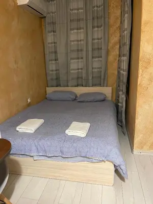 a bedroom with a bed with two towels on it at Colonel apartment 955 in Sofia