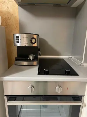 a kitchen with a counter top with a coffee maker at Colonel apartment 955 in Sofia