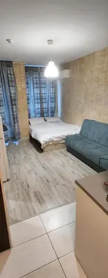 a living room with a bed and a couch at Colonel apartment 959 in Sofia