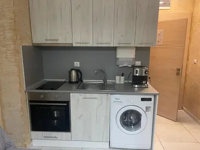 a kitchen with a sink and a washing machine at Colonel apartment 959 in Sofia