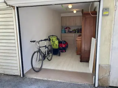 a garage with a bike parked in it at Orfey Apartment in Sofia